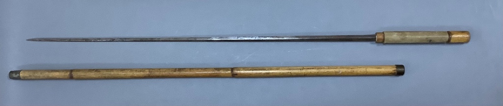 A 19th century bamboo swordstick, with vellum mounted handle and worn blued steel blade, overall length 89cm